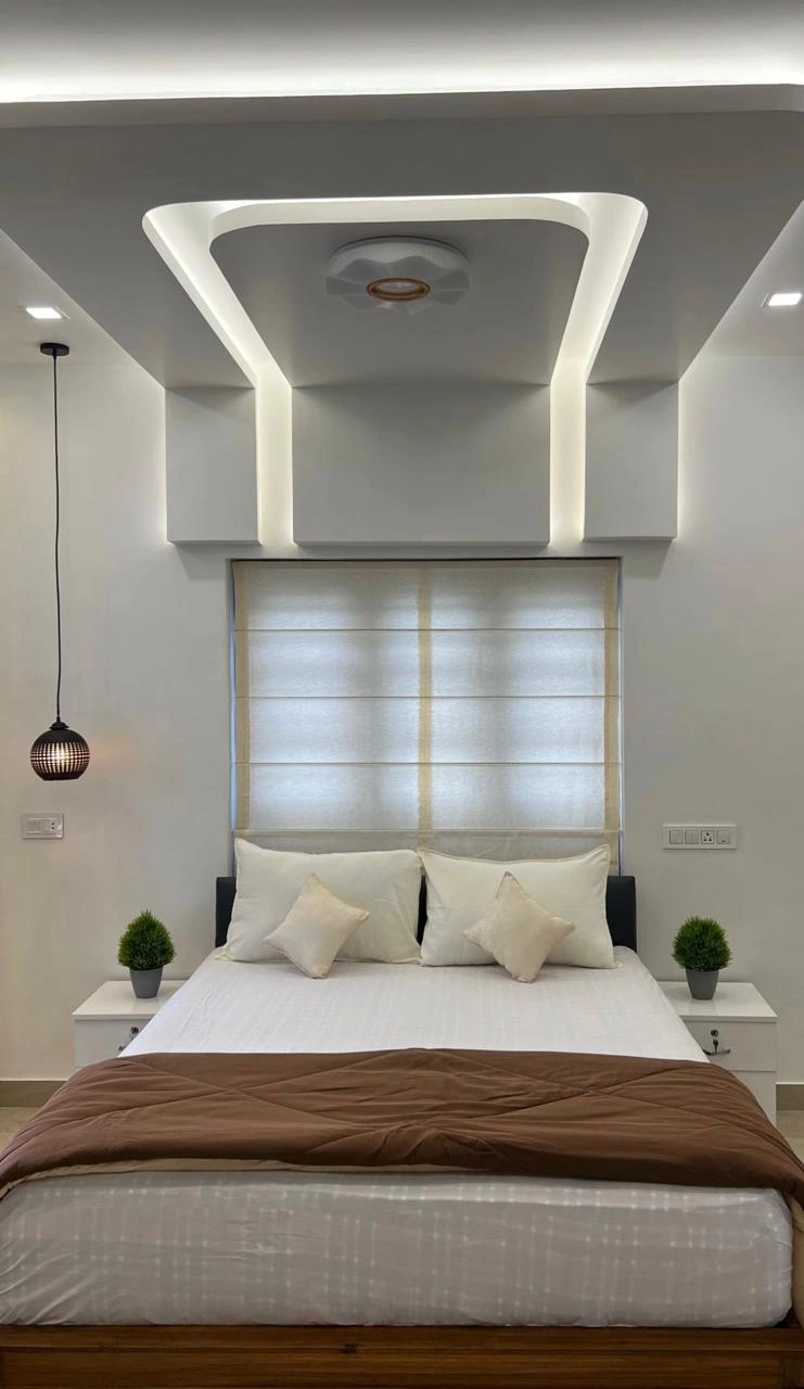A minimal bedroom decorated by interior designing company in Malappuram